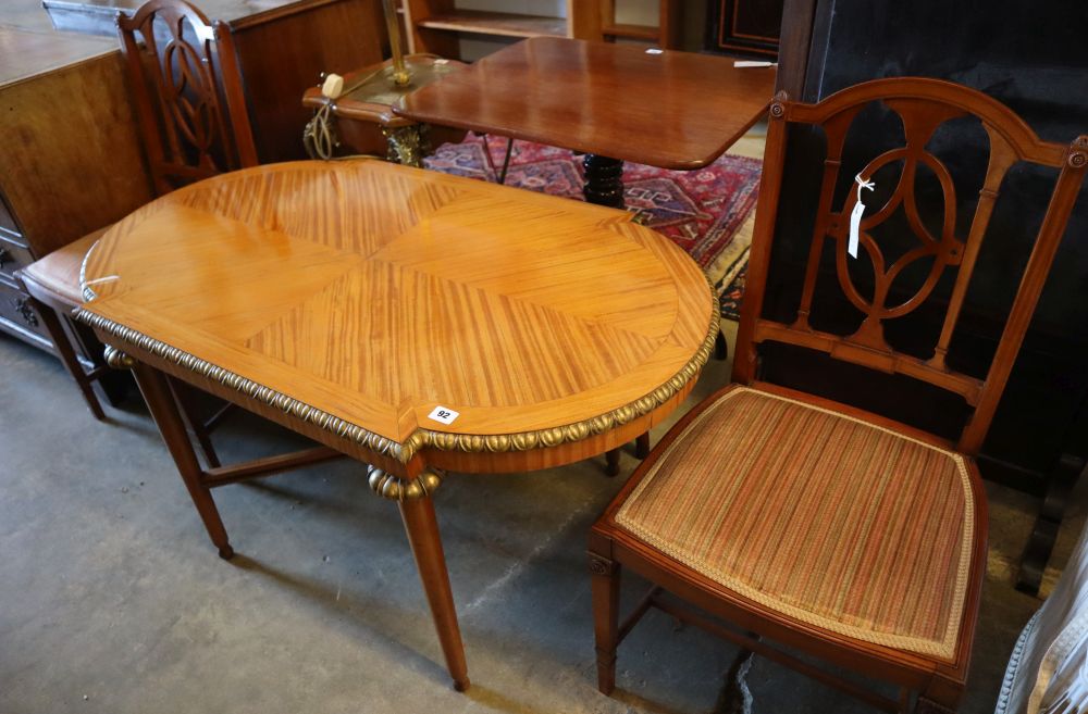 A parcel gilt satinwood centre table, width 113cm height 62cm, and a pair of Edwardian satinwood salon chairs